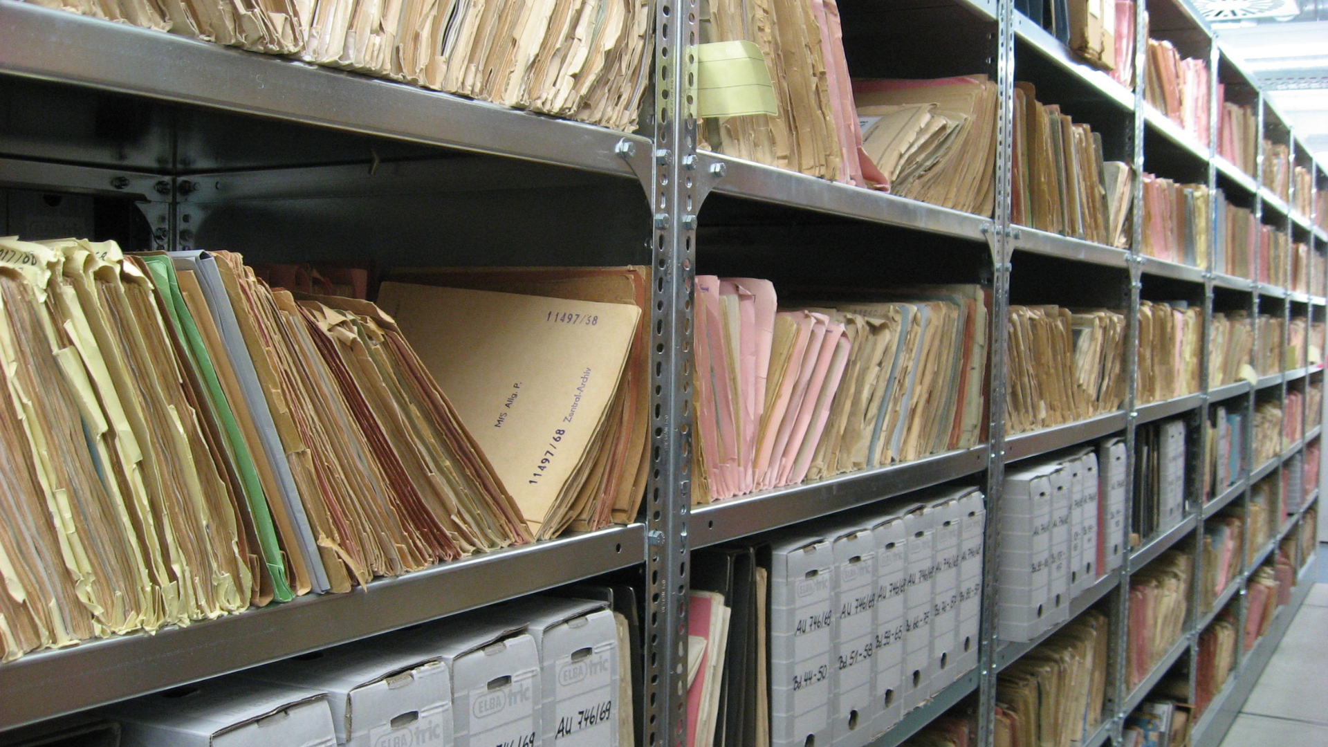 An image of an overcrowded file room in need of digitization and scanning.
